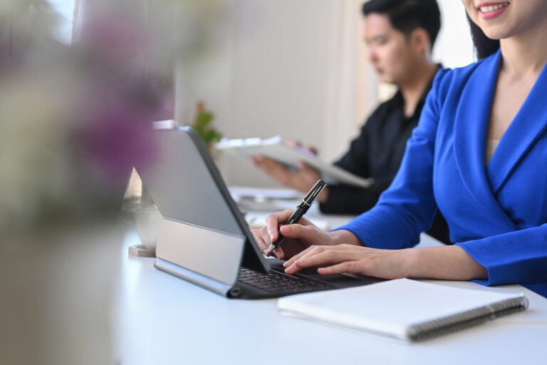 Cropped shot smiling business woman sitting in meeting room and